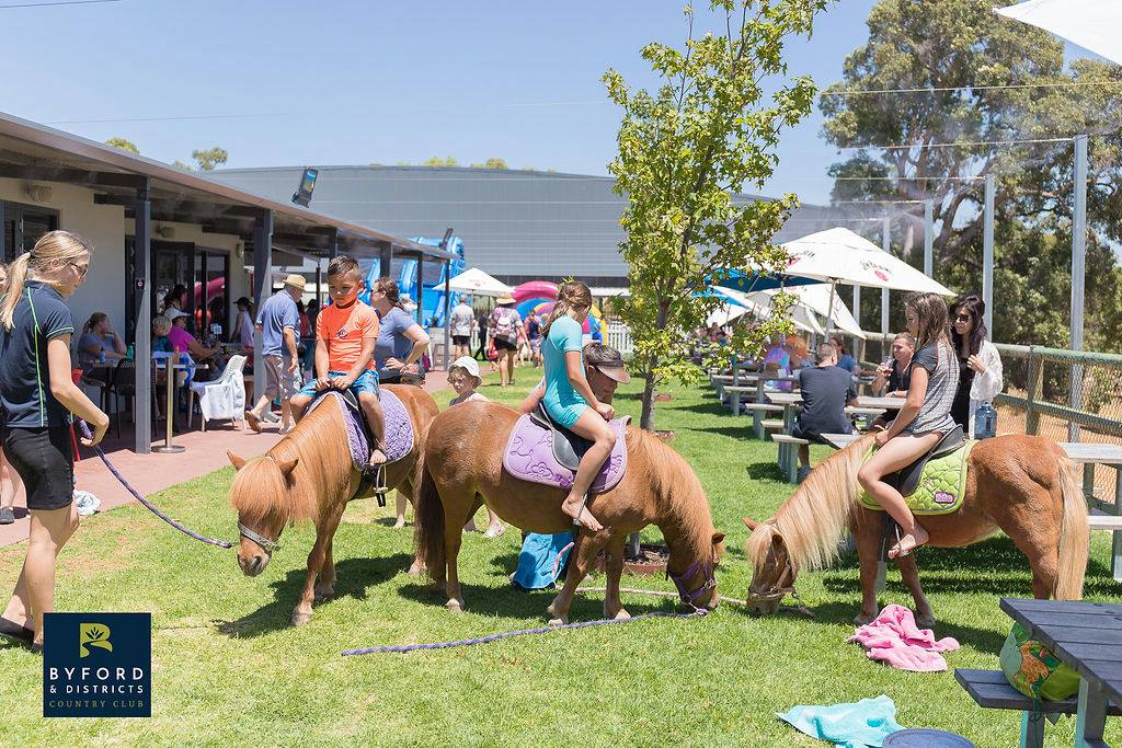eople socialising at a club event outdoors