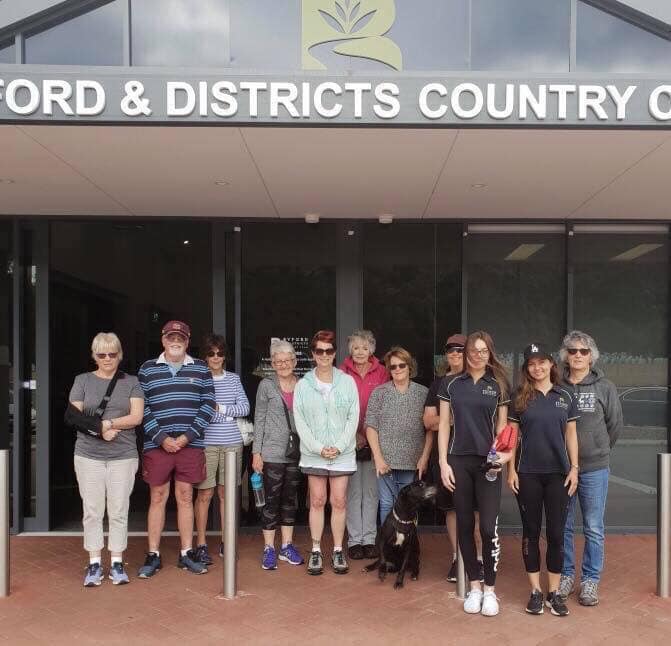 People socialising at an outdoor club event