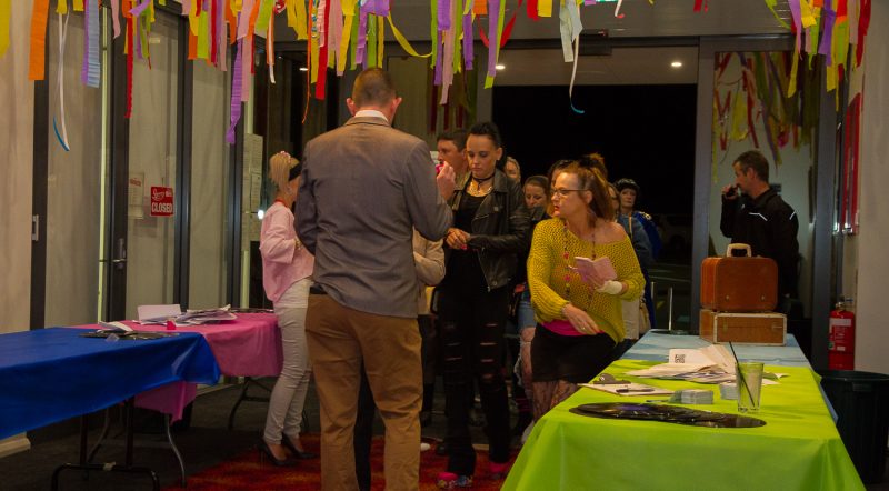 People socialising at a club event indoors